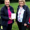 Doreen Longhurst being presented her Anglia Brooch by Alison Tompkinson